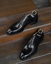 Handcrafted Black Leather Wingtip Oxfords – Formal Luxury