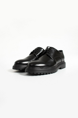 Elegant black leather formal derby shoes featuring a sleek design, sturdy lace-up closure, and durable rugged sole,