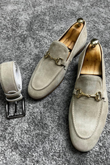 Stylish beige suede loafers with gold bit accents, perfect for classy and sophisticated occasions.